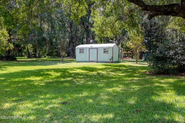 a view of a tiny house with a yard