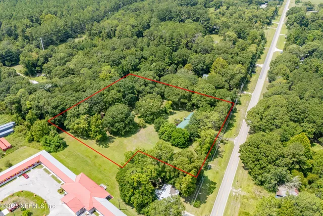 a view of a yard with an outdoor space