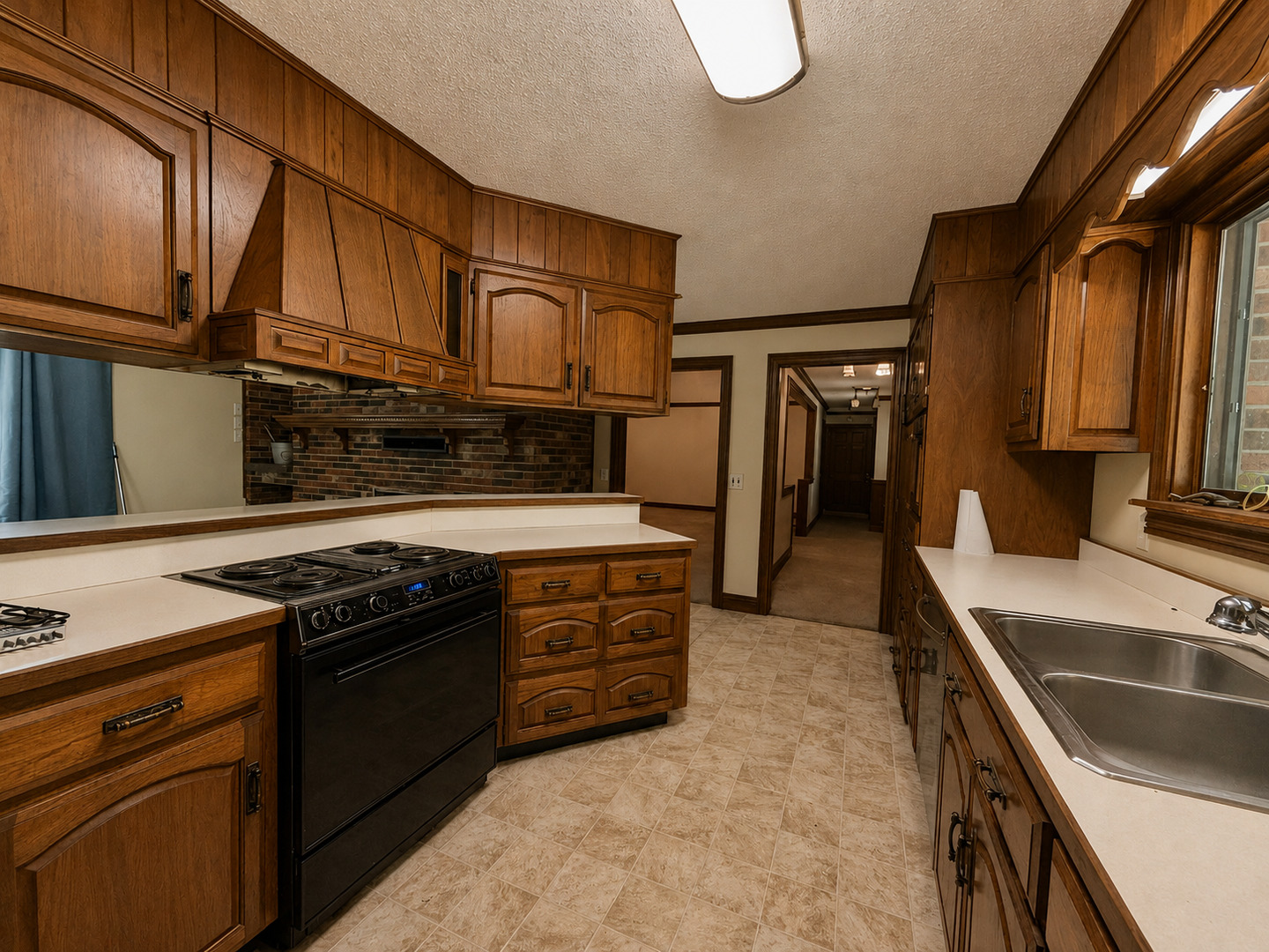 5996 South US 45 Road Metropolis, IL 62960 - Photo 11 of 41 a kitchen with stainless steel appliances granite countertop a stove a sink and a refrigerator