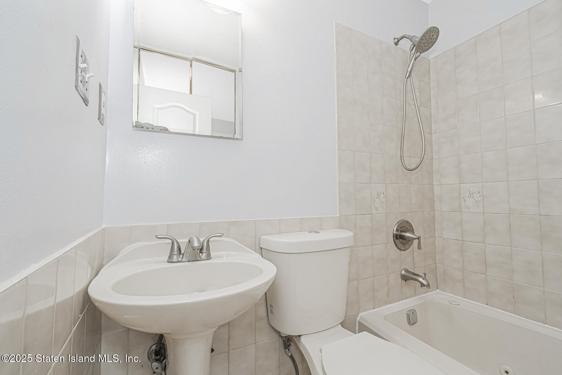 34 Lorraine Loop Staten Island, NY 10309 - Photo 19 of 33 a bathroom with a sink a toilet and shower