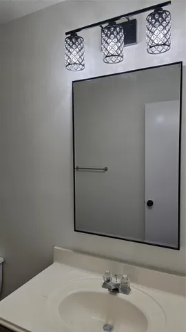 a bathroom with a sink and vanity