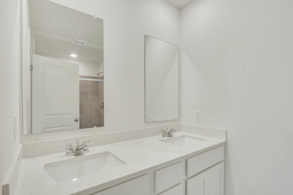 567 Yosemite Way Mundelein, IL 60060 - Photo 17 of 58 a bathroom with a sink and a mirror