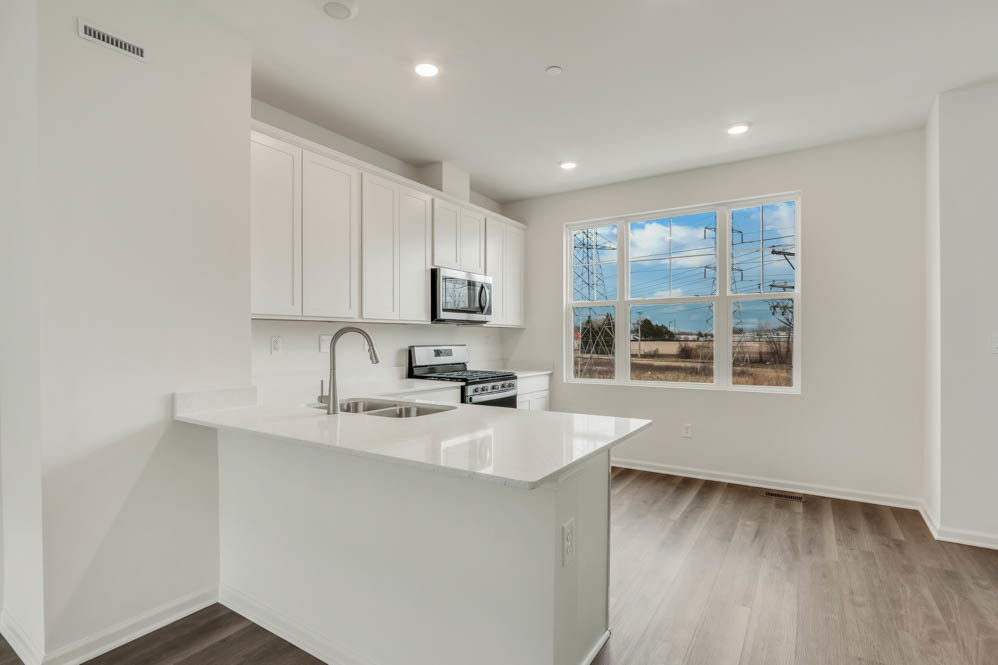 567 Yosemite Way Mundelein, IL 60060 - Photo 4 of 58 a kitchen with a sink a window and cabinets
