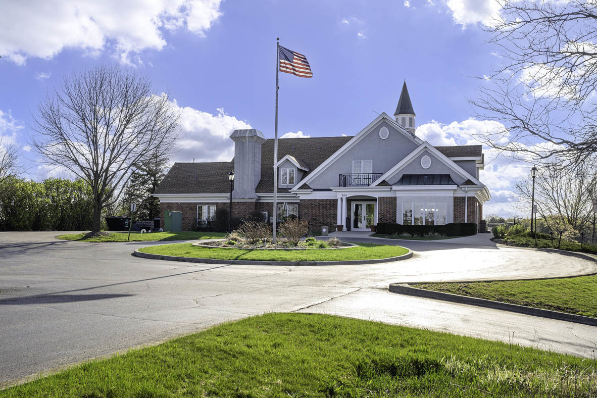 567 Yosemite Way Mundelein, IL 60060 - Photo 45 of 58 a front view of a house with a yard table and chairs