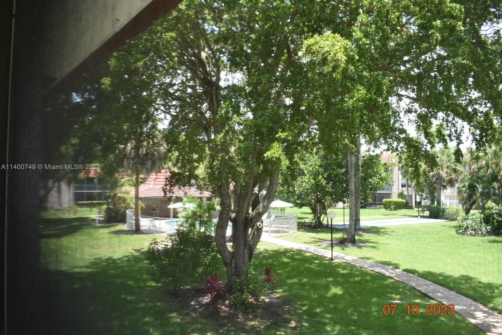 3501 Inverrary Drive, Unit 204 Lauderhill, FL 33319 - Photo 1 of 18 a huge green field with lots of trees