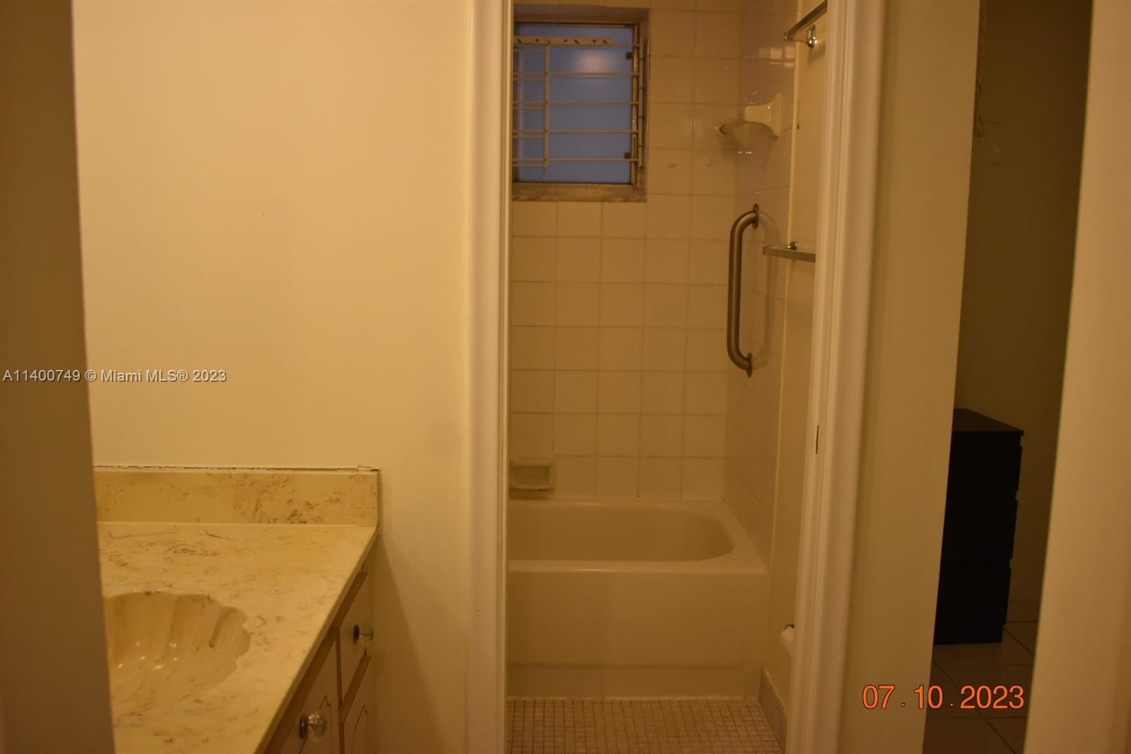 3501 Inverrary Drive, Unit 204 Lauderhill, FL 33319 - Photo 12 of 18 a bathroom with a shower