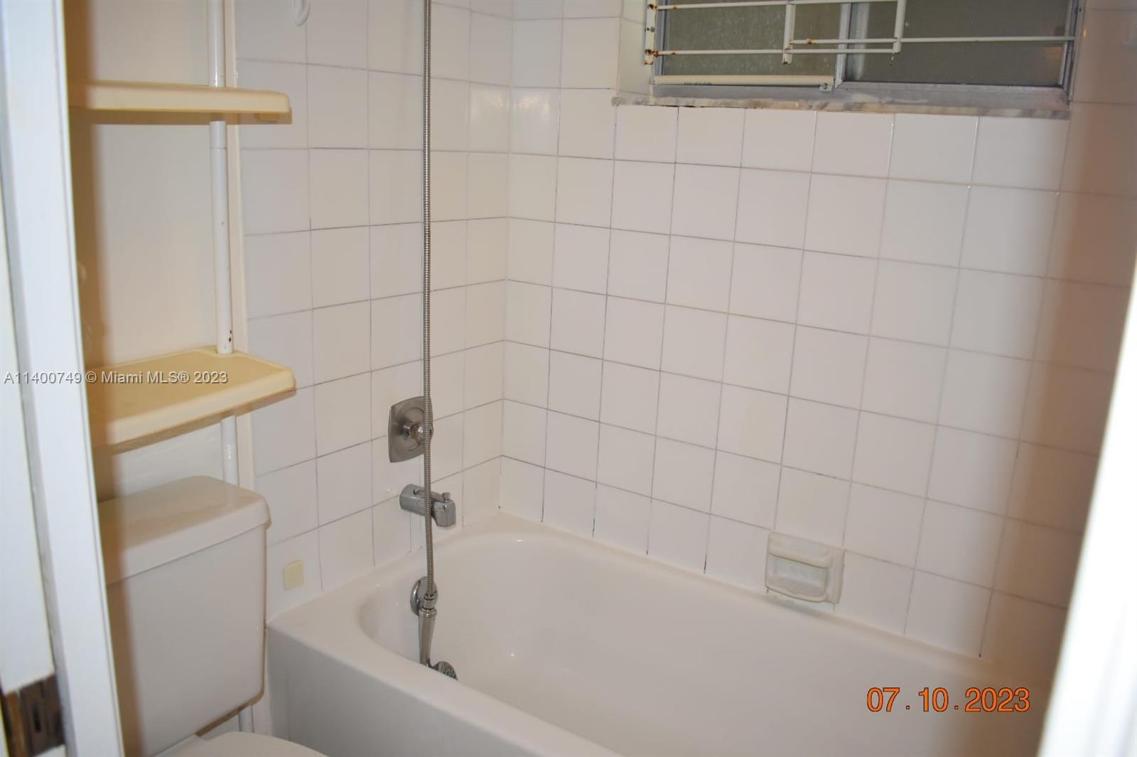 3501 Inverrary Drive, Unit 204 Lauderhill, FL 33319 - Photo 14 of 18 a bathroom with a bathtub
