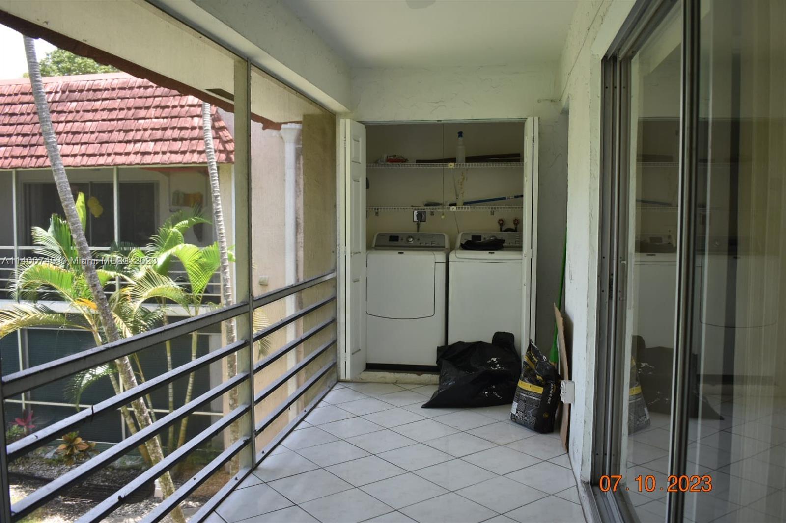 3501 Inverrary Drive, Unit 204 Lauderhill, FL 33319 - Photo 16 of 18 a view of a balcony with chair and a potted plant