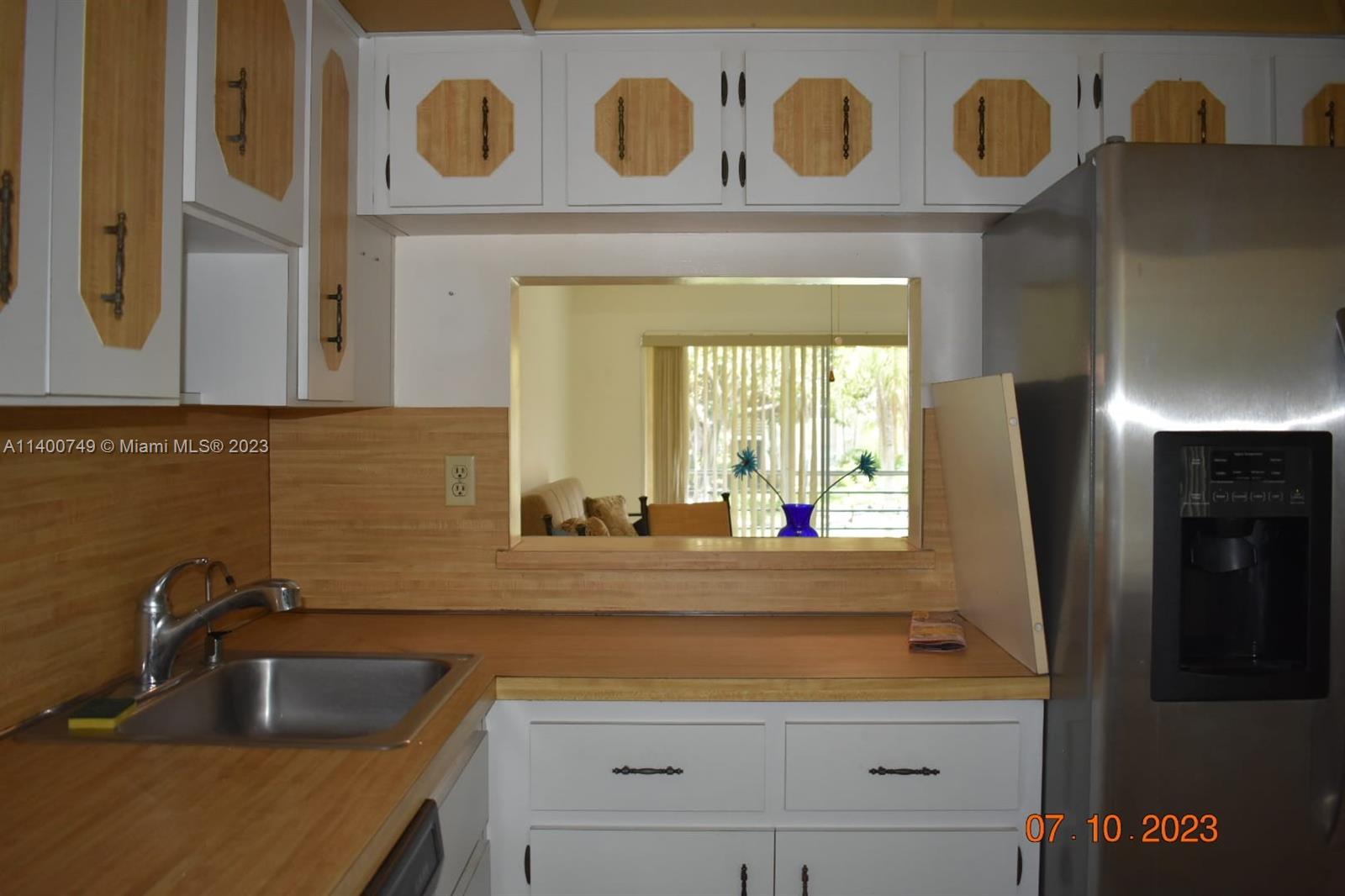 3501 Inverrary Drive, Unit 204 Lauderhill, FL 33319 - Photo 4 of 18 a bathroom with a sink and a mirror