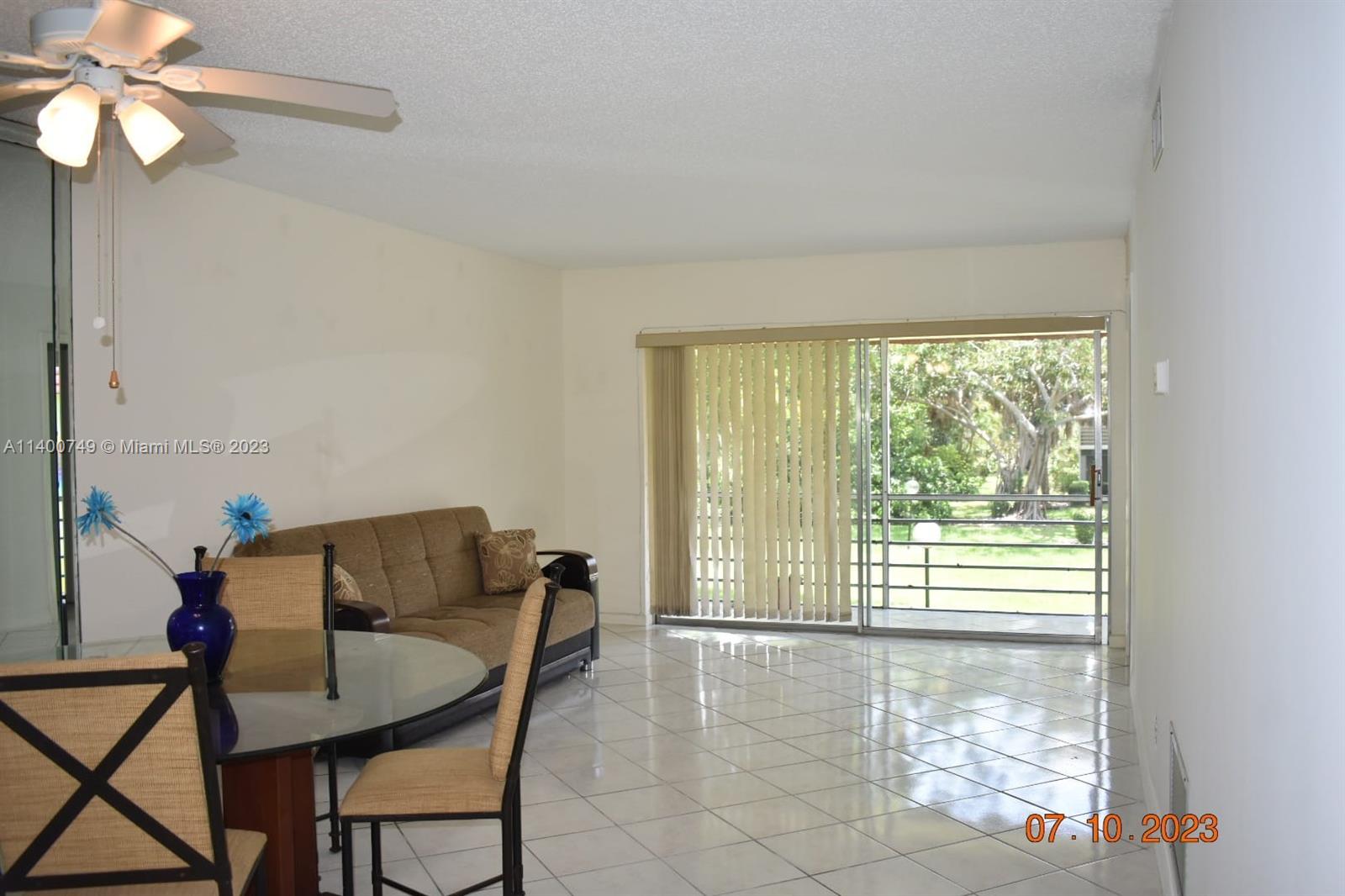 3501 Inverrary Drive, Unit 204 Lauderhill, FL 33319 - Photo 6 of 18 a view of a livingroom with furniture and a large window