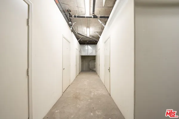 a view of entryway and hall with a front door