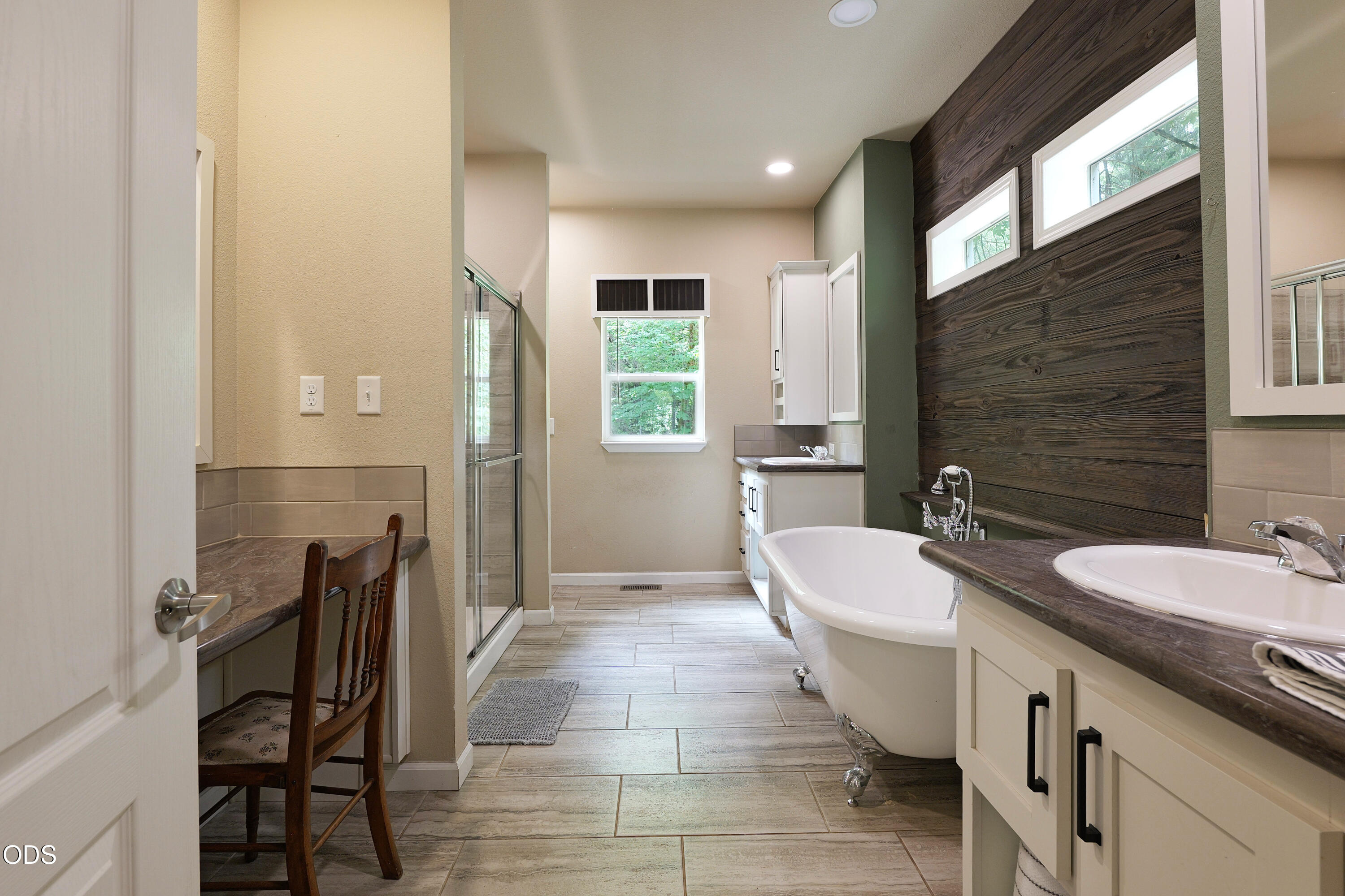 52 Dodes Creek Road Trail, OR 97541 - Photo 48 of 111 a spacious bathroom with a double vanity sink a mirror and a bathtub