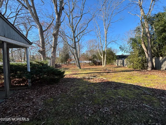 a bathroom with a granite countertop shower and a toilet