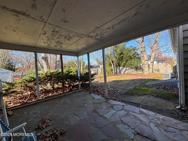 a bathroom with a granite countertop shower and a toilet