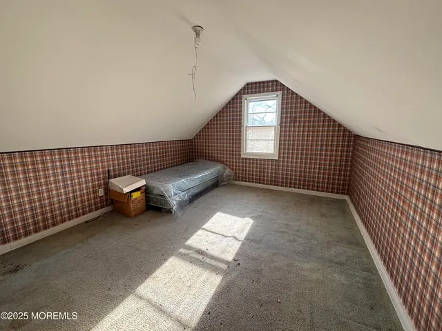 a view of a house with backyard porch and sitting area
