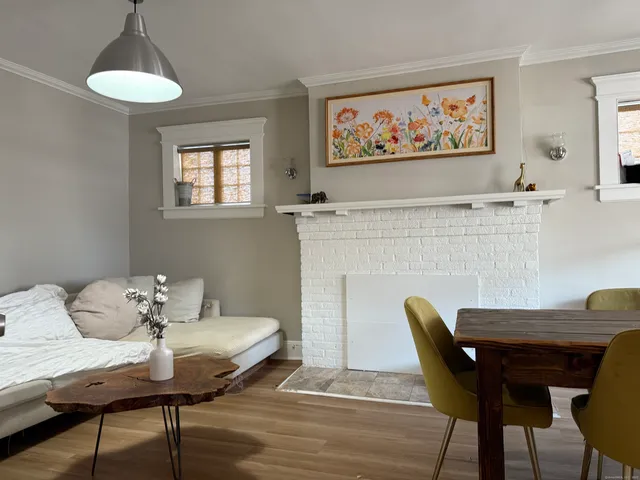 a dining room with furniture and a fireplace
