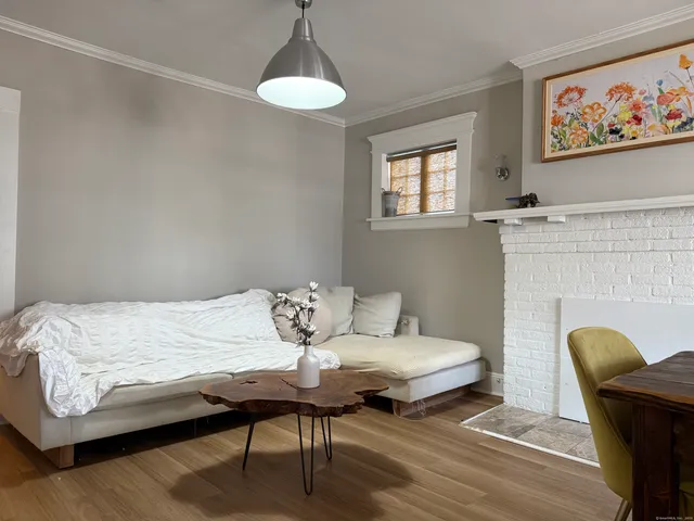 a bedroom with a bed and a table in it