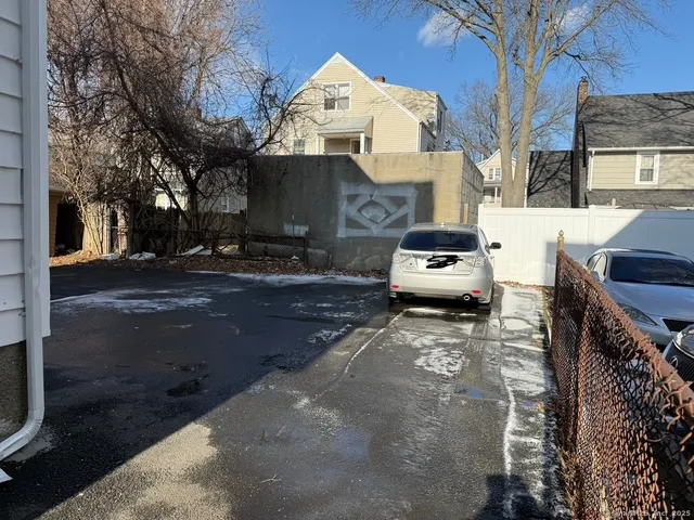 a car parked in front of a house