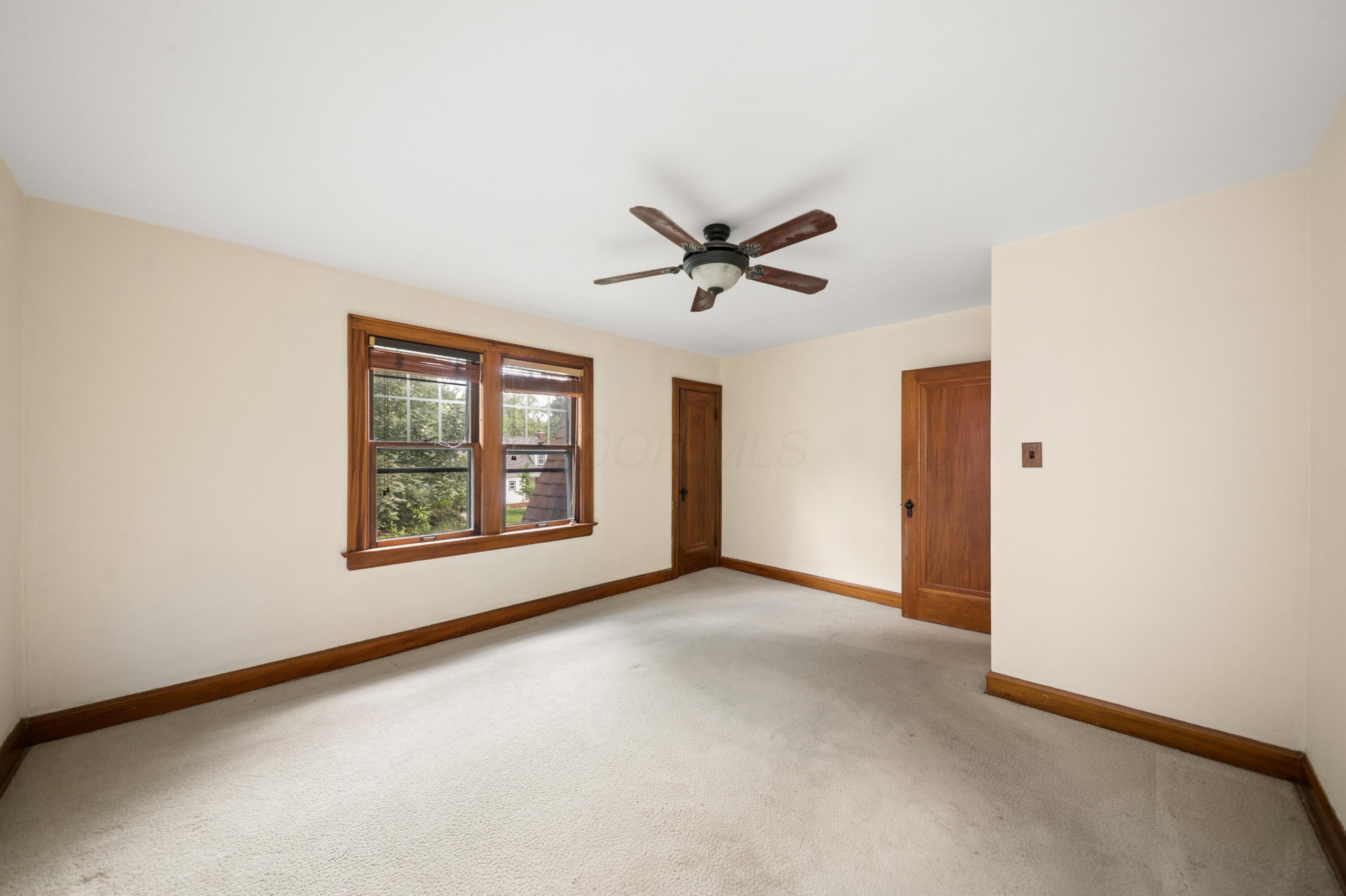 393 Mimring Road Columbus, OH 43202 - Photo 41 of 55 Bedroom 3, large bedroom with big closet and lots of light. wood floors under carpet