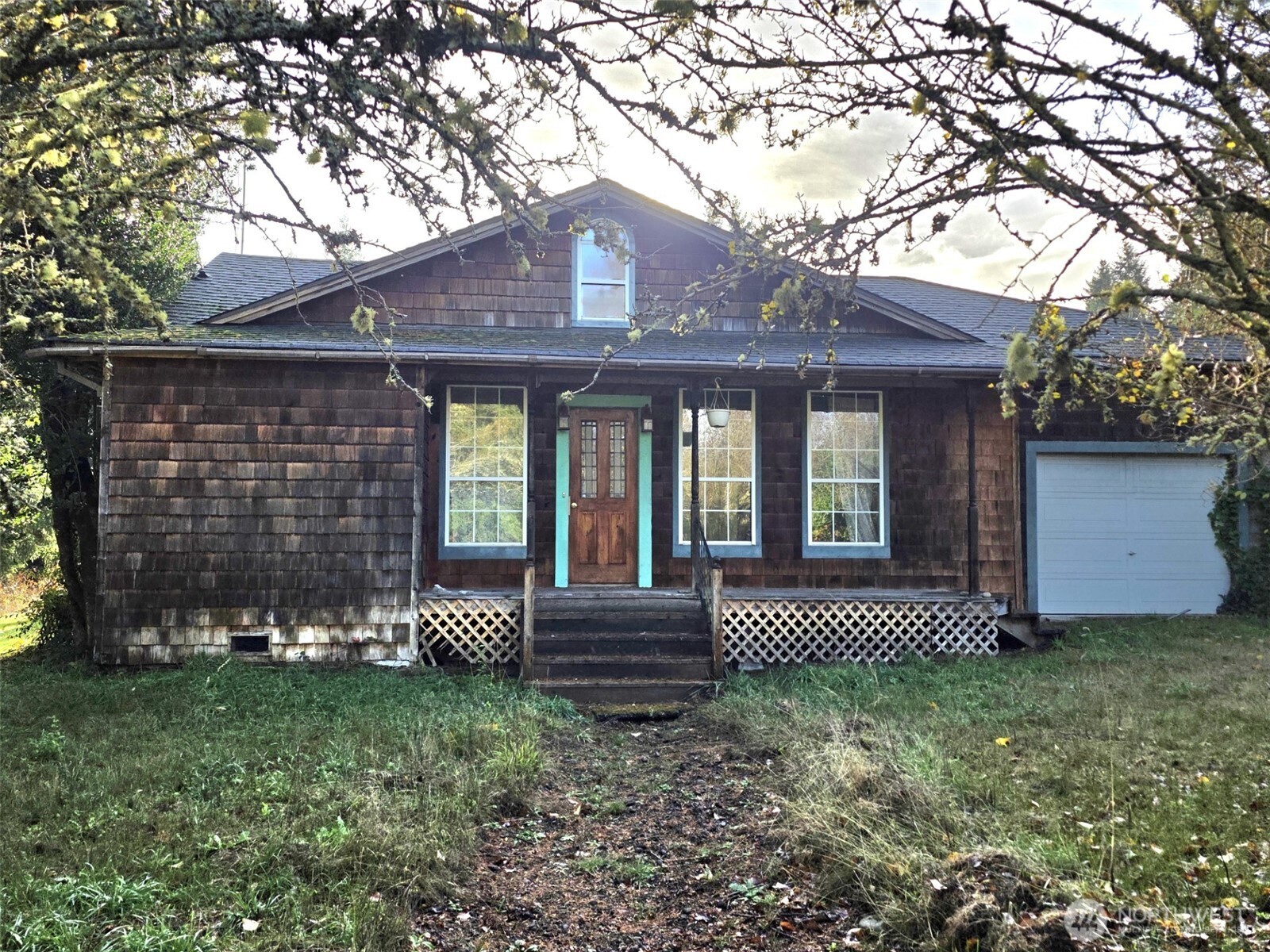 10524 Clark Road Southeast Yelm, WA 98597 - Photo 4 of 10 a front view of a house with garden