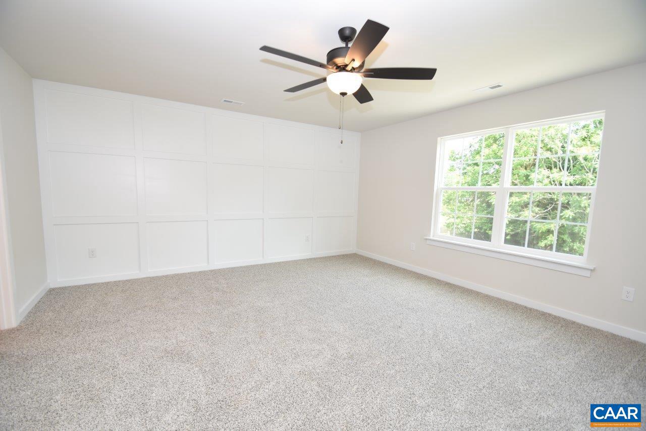 11675 West Jack Jouett Road Zion Crossroads, VA 22942 - Photo 20 of 33 an empty room with a window and a fan