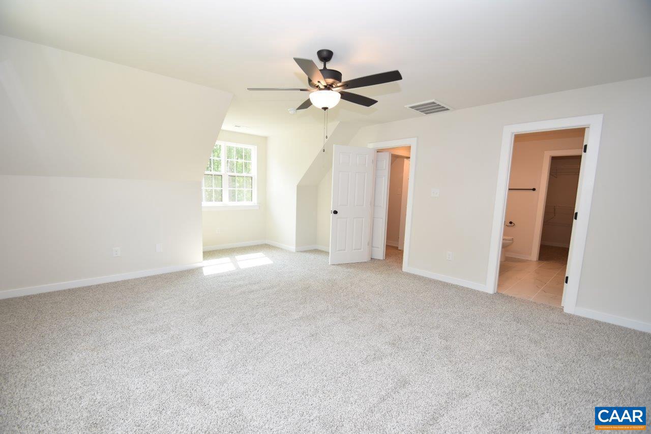 11675 West Jack Jouett Road Zion Crossroads, VA 22942 - Photo 24 of 33 a view of a livingroom with a ceiling fan and window