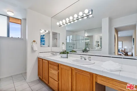 a bathroom with a sink a vanity and a mirror