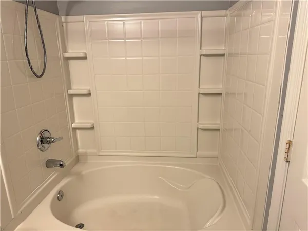a bathroom with a bath tub