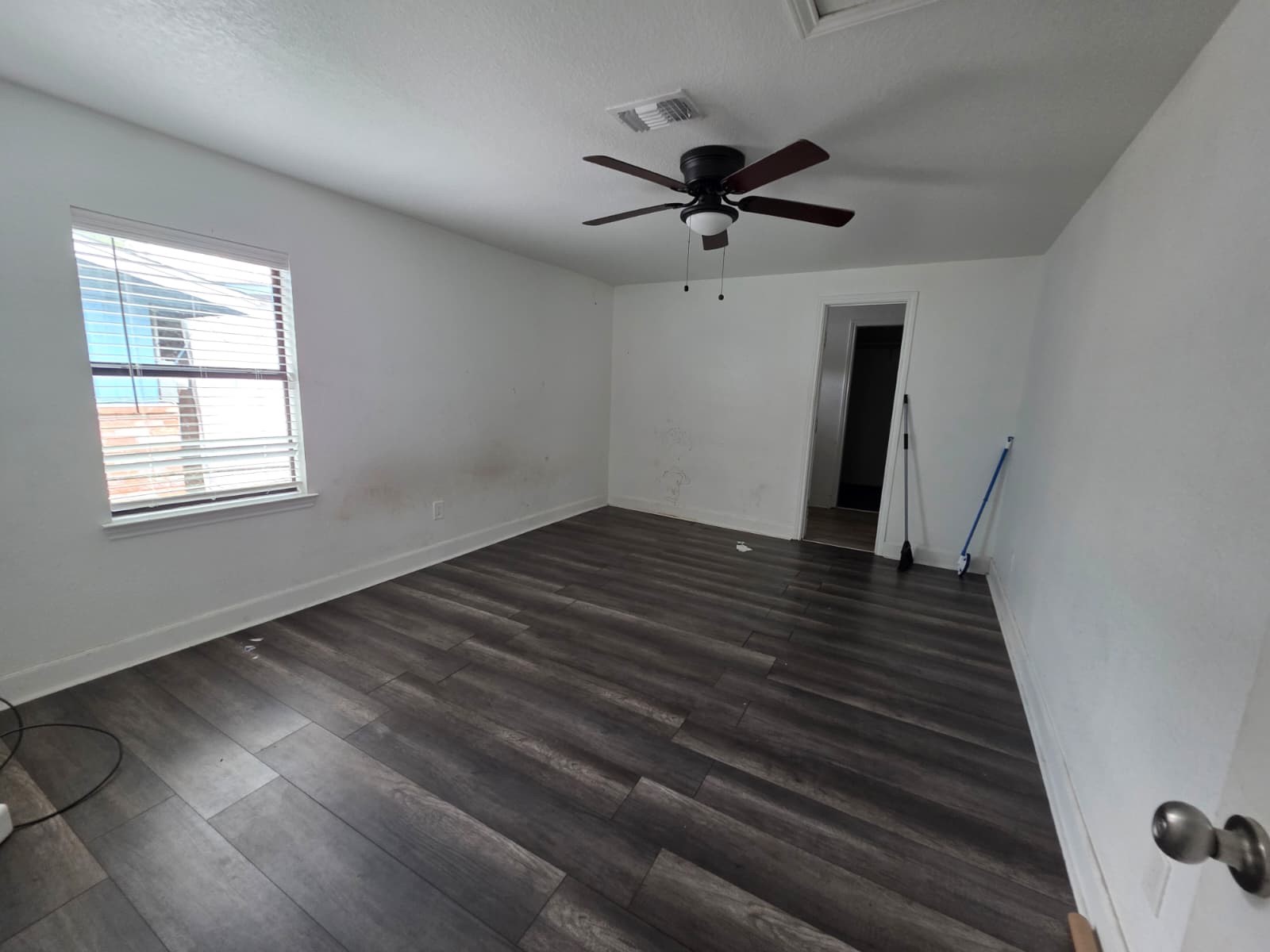 10015 Porto Rico Road Houston, TX 77041 - Photo 14 of 20 a view of empty room with wooden floor and fan