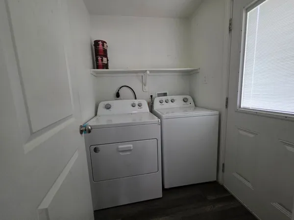 a utility room with dryer and washer