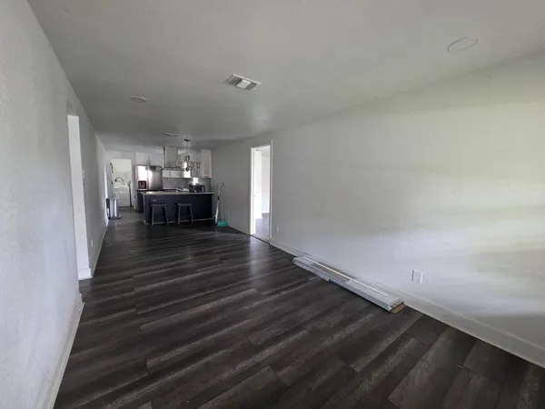 a view of dining room and hall with wooden floor