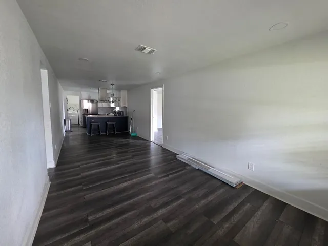 a view of dining room and hall with wooden floor