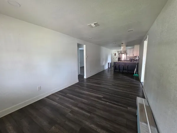 a view of dining room and wooden floor