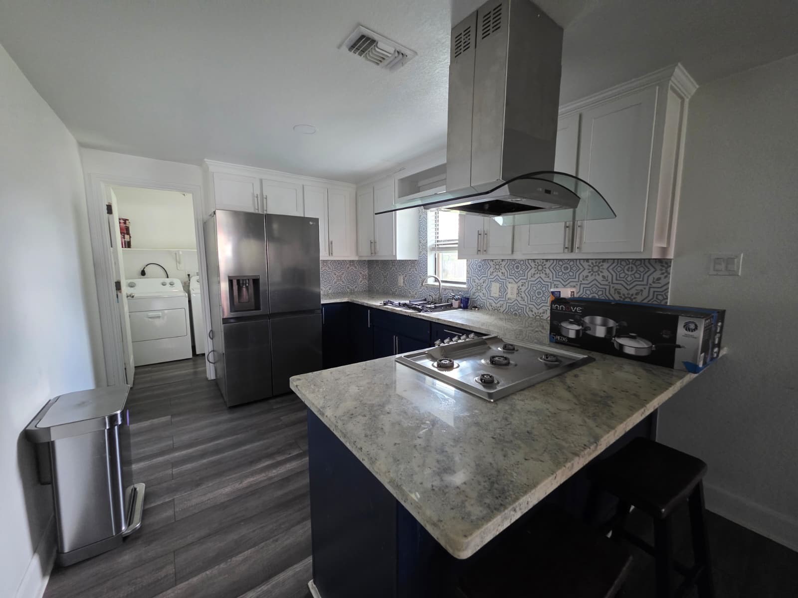 10015 Porto Rico Road Houston, TX 77041 - Photo 5 of 20 a kitchen with stainless steel appliances granite countertop a sink a stove and a refrigerator