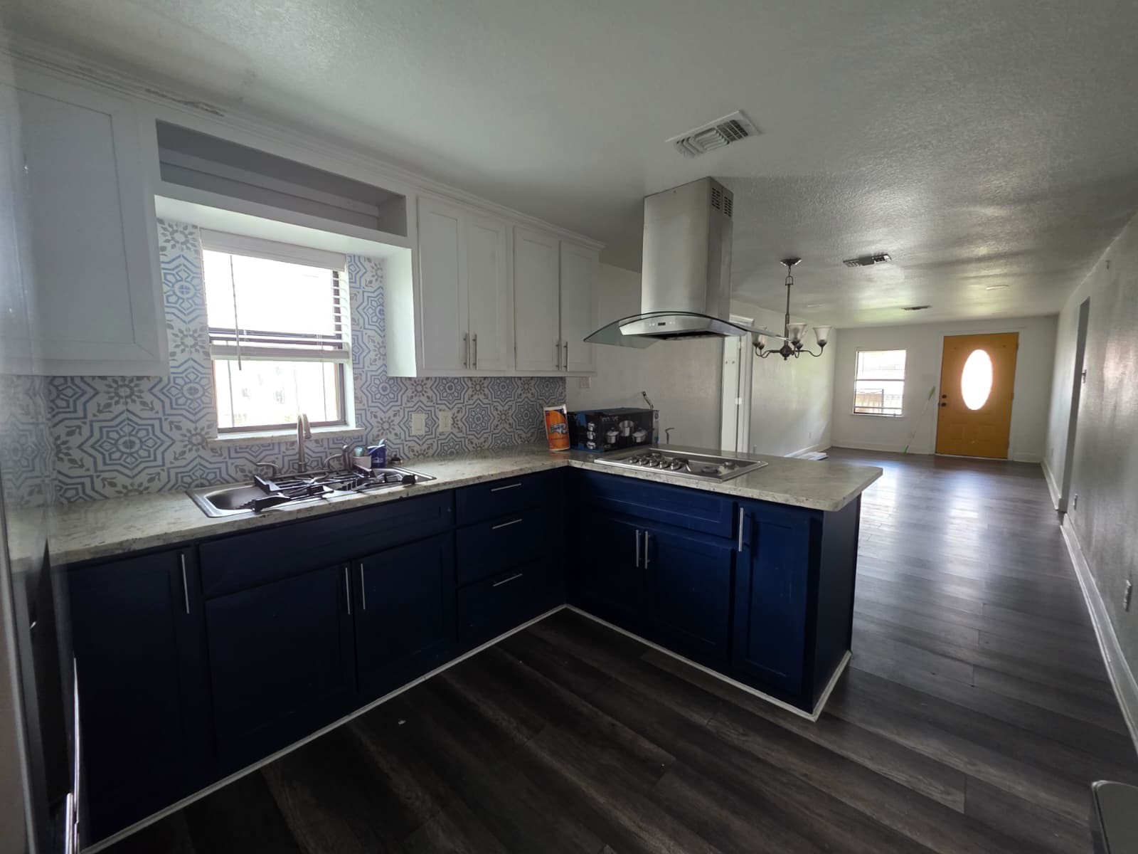 10015 Porto Rico Road Houston, TX 77041 - Photo 7 of 20 a kitchen with stainless steel appliances granite countertop a stove a sink and a window