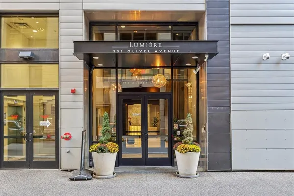 a front view of a building with outdoor seating