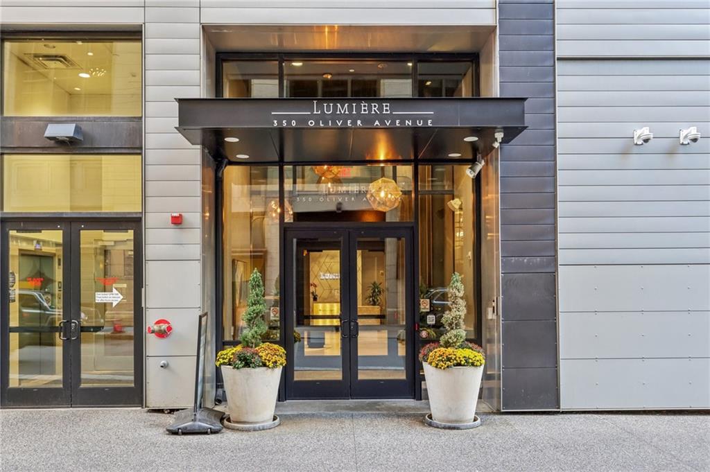 a front view of a building with outdoor seating