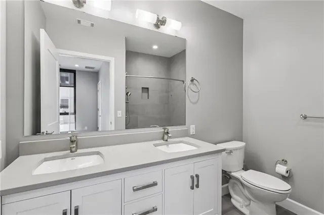 a view of a hallway with entryway wooden floor and front door