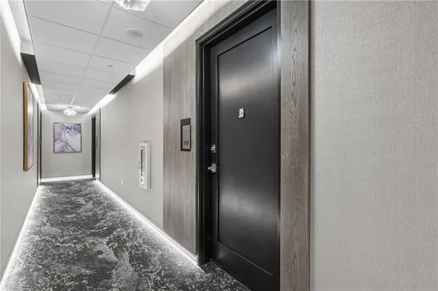 a view of a hallway with seating area