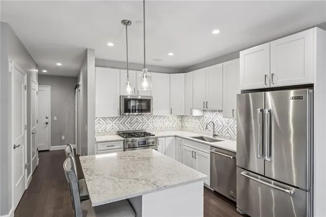 a bathroom with a toilet sink and shower
