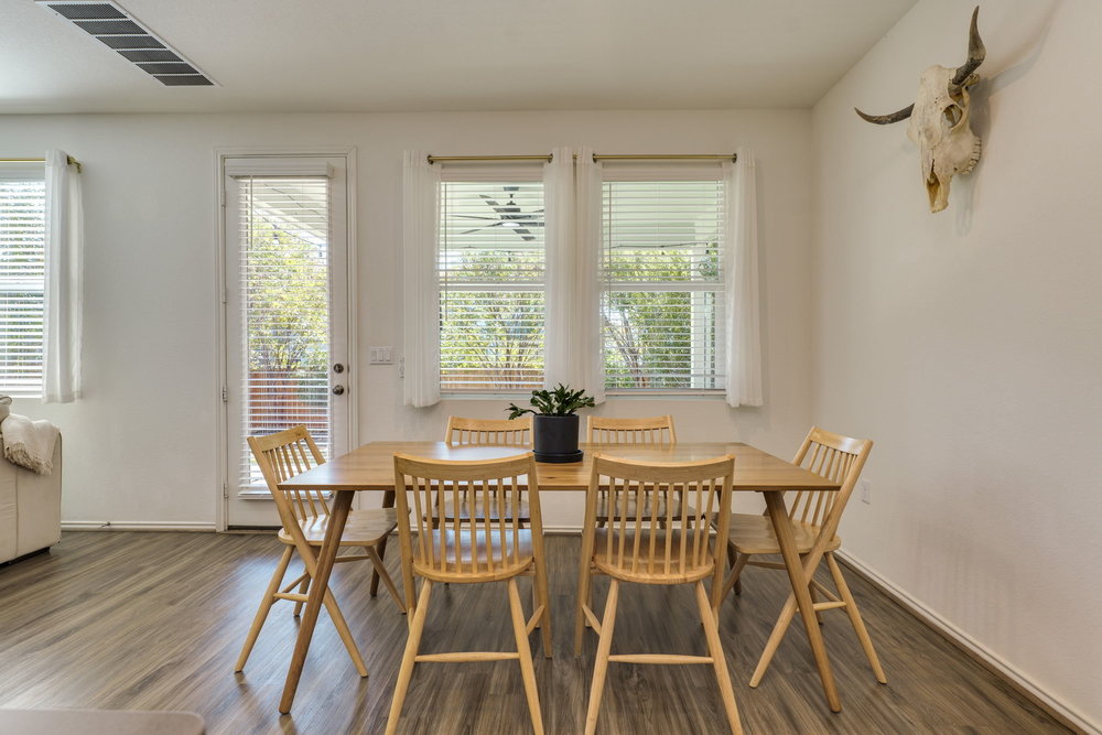 1107 Winifred Drive Austin, TX 78748 - Photo 15 of 40 Light-filled dining area overlooking the backyard perfect for weeknight dinners or brunch with friends.