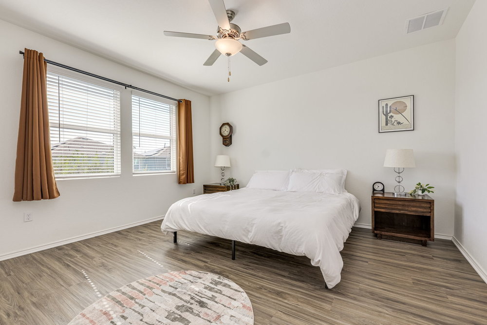 1107 Winifred Drive Austin, TX 78748 - Photo 18 of 40 Spacious primary suite with room to relax and unwind in natural light.