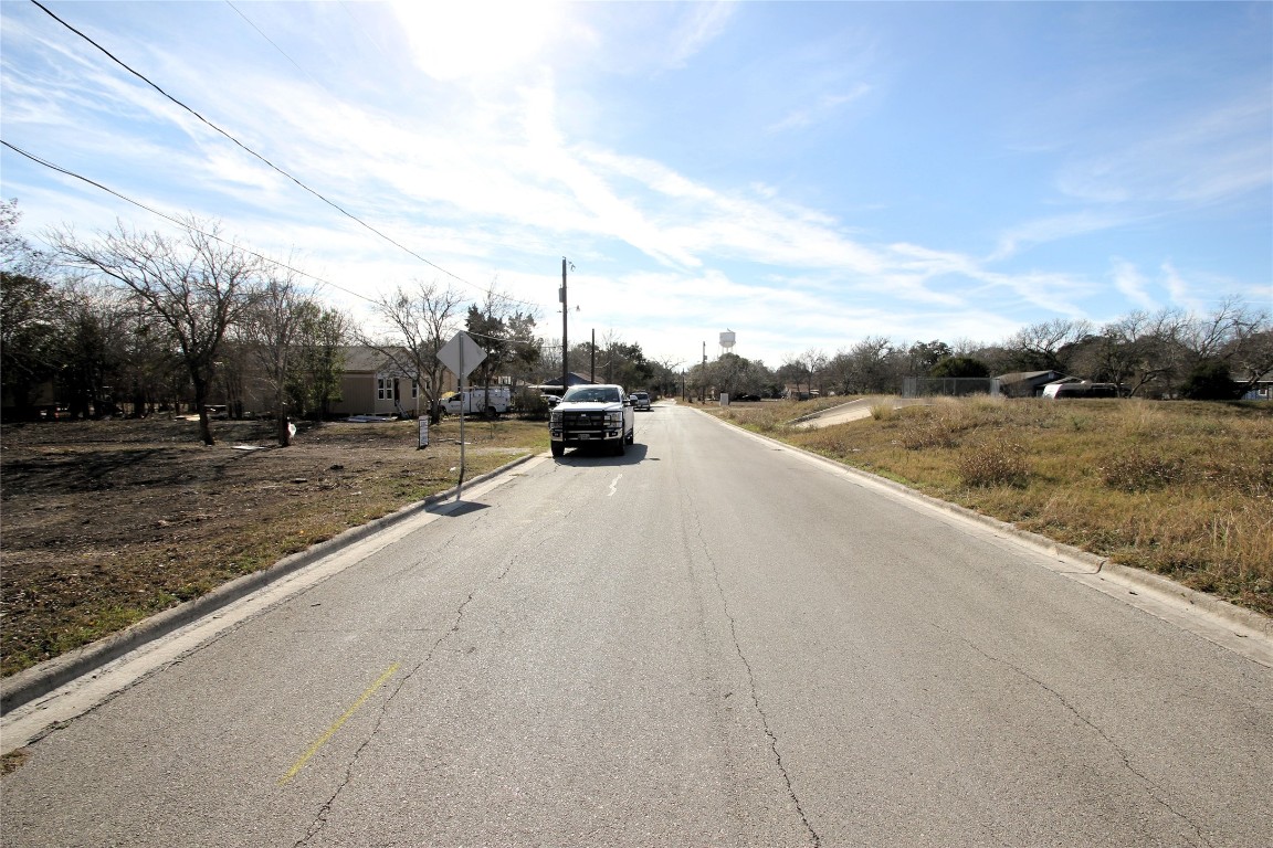 1104 Wichita Street Lockhart, TX 78644 - Photo 6 of 7 a view of a dry yard with wooden fence