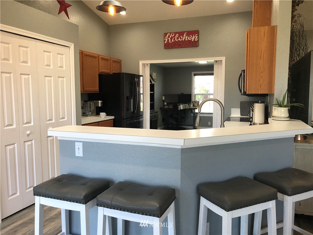 9131 Applegate Loop Southwest Rochester, WA 98579 - Photo 12 of 32 a kitchen with a table and chairs