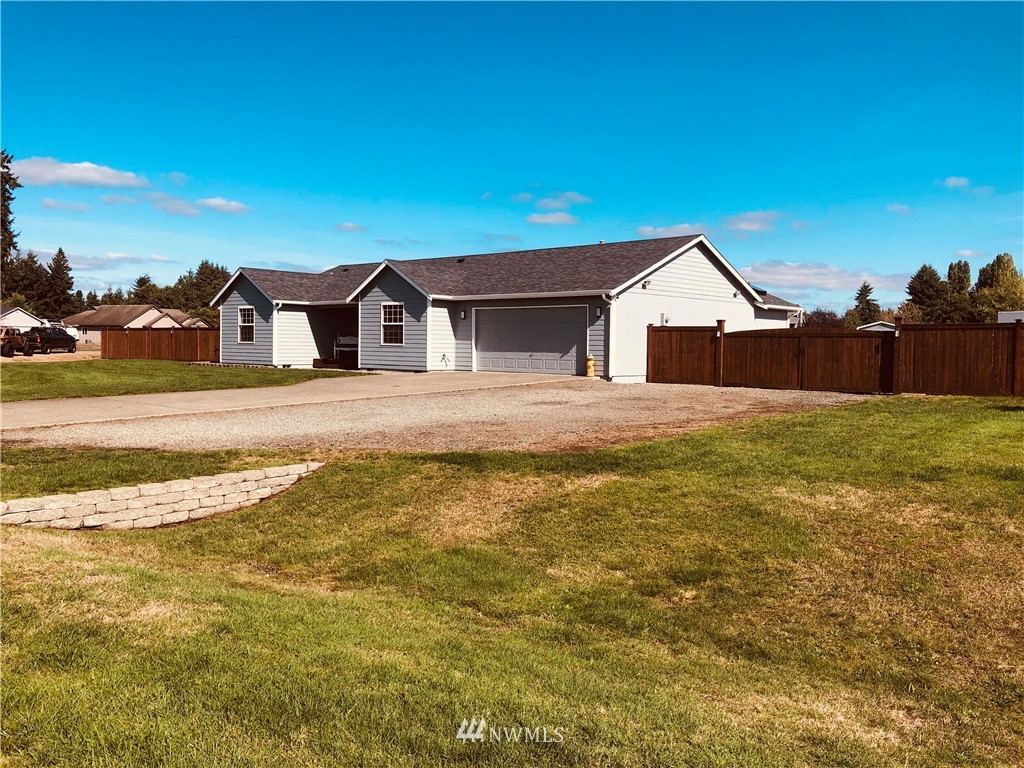 9131 Applegate Loop Southwest Rochester, WA 98579 - Photo 29 of 32 a view of a house with a patio