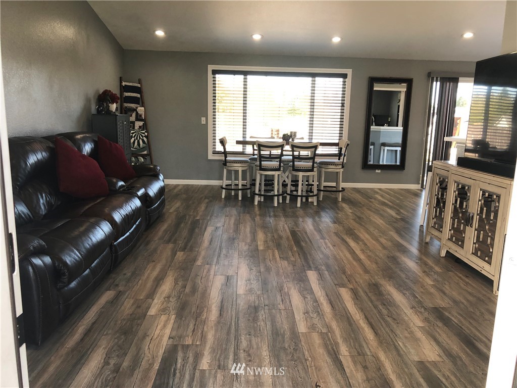 9131 Applegate Loop Southwest Rochester, WA 98579 - Photo 6 of 32 a living room with furniture and wooden floor