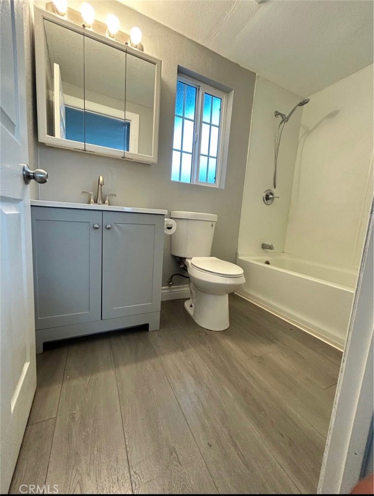 2249 Serrano Road North San Bernardino, CA 92405 - Photo 24 of 26 a bathroom with a sink a toilet and shower