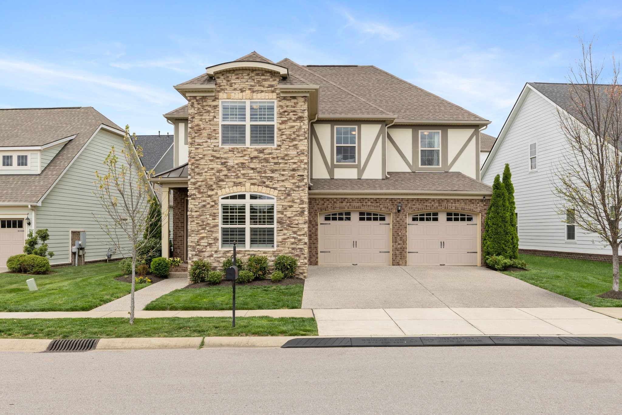a front view of a house with a yard