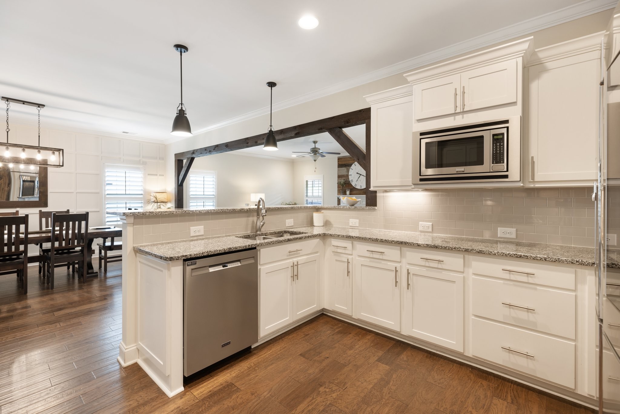 1044 Scouting Drive Franklin, TN 37064 - Photo 29 of 87 a kitchen with stainless steel appliances granite countertop a stove and a wooden floors