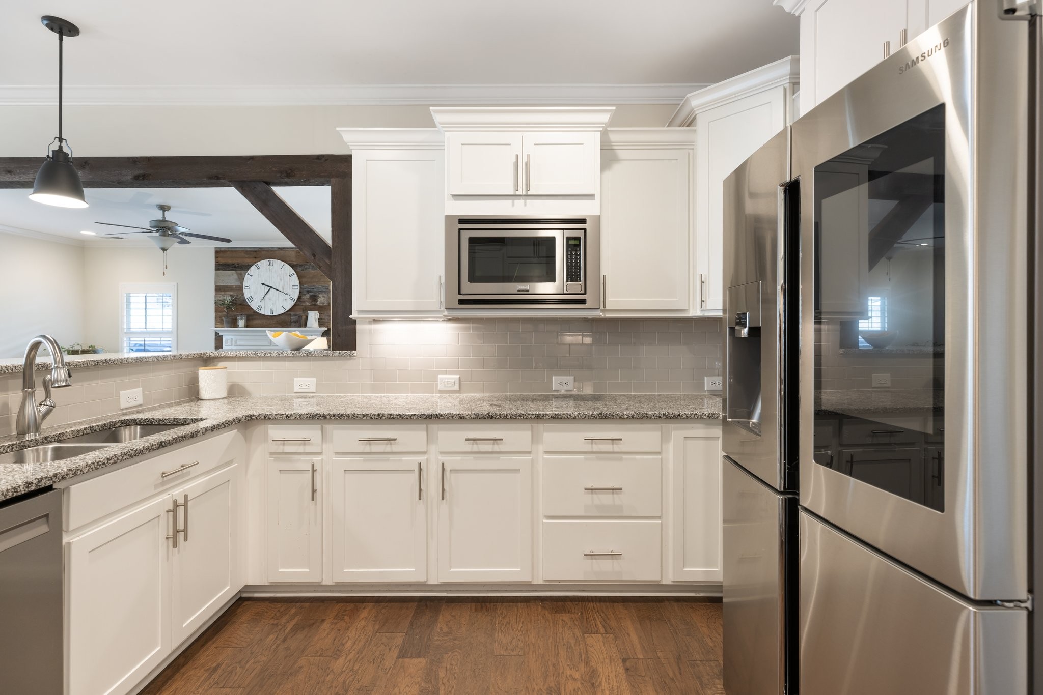 1044 Scouting Drive Franklin, TN 37064 - Photo 30 of 87 a kitchen with granite countertop a sink and stainless steel appliances